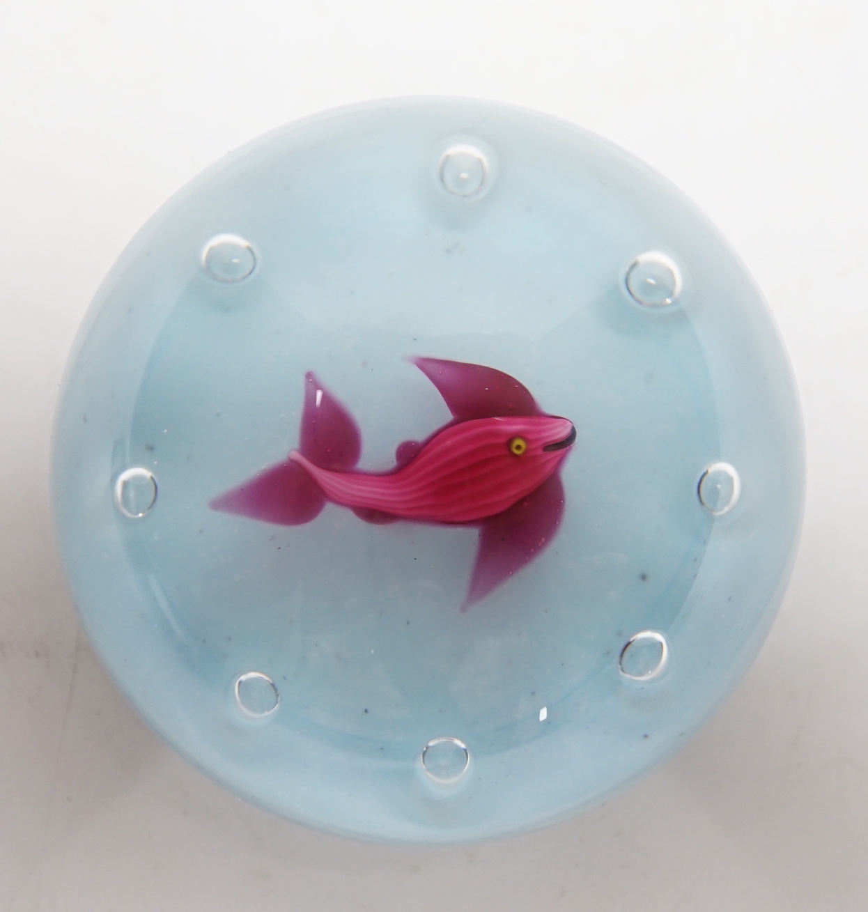 A Paul Ysart ‘fish’ glass paperweight, Harland period, opaque white ground, ‘H’ cane, paper label, 7cm